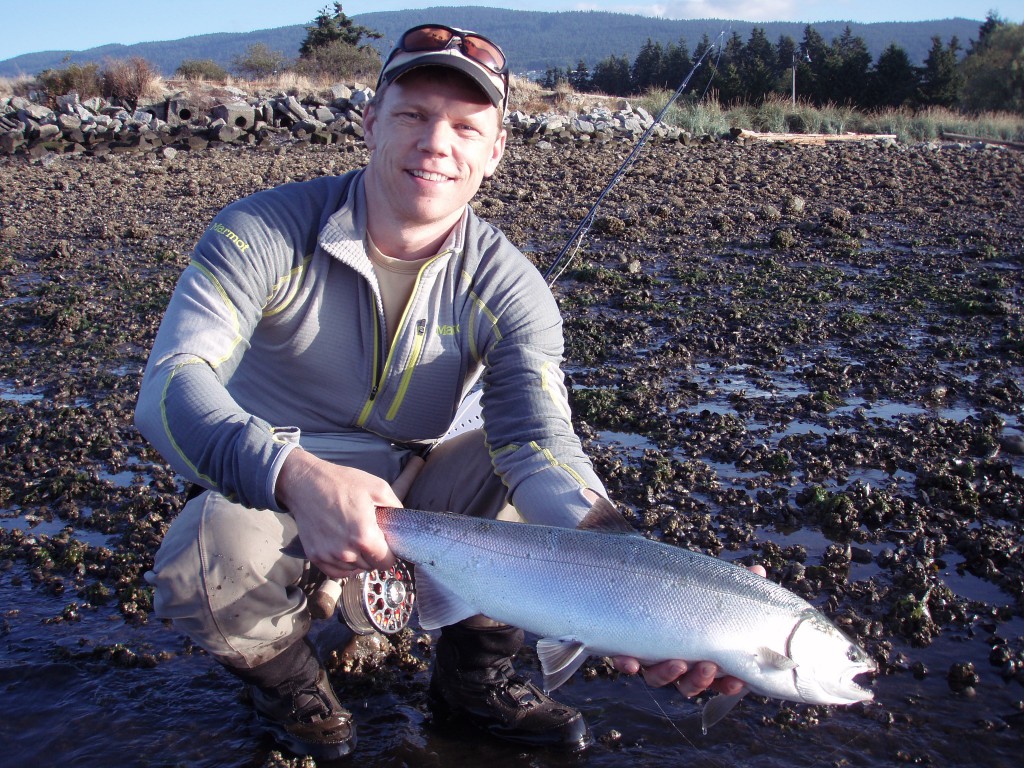Chris with a beauty coho on a guided trip after he took the beach fishing course last year.